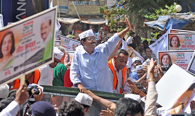 Aam-Aadmi-Party-(AAP)-leader-Arvind-Kejriwal-during-a-road-show-part-of-party`s-election-campaign-for-upcoming-2014