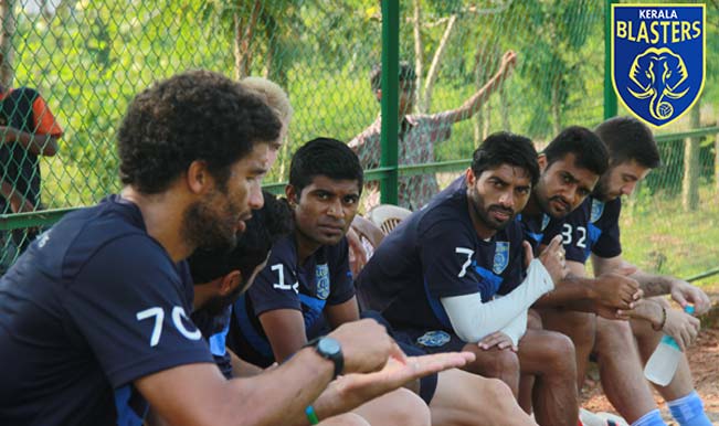 David James (left) in discussion with his teammates.