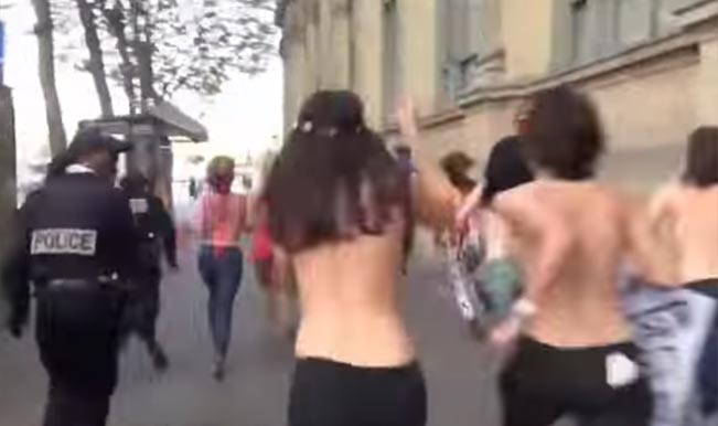 Topless Women Of Femen Chased By Cops On The Street Watch Video India Com