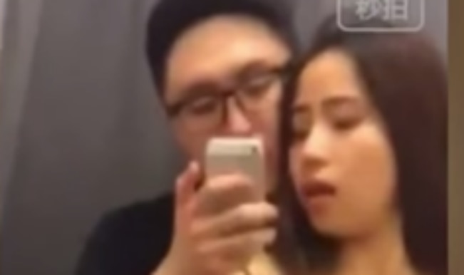 OMG! Chinese couple caught having sex in retail store Uniqlo (Watch Video) India picture