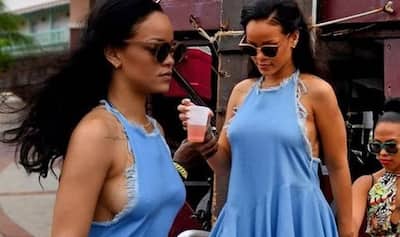 Singer Rihanna 'forgets' to wear bra under denim dress