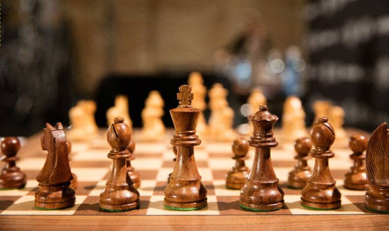 Representative image of a chess board and pieces.