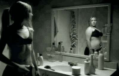 Checking Body In Mirror