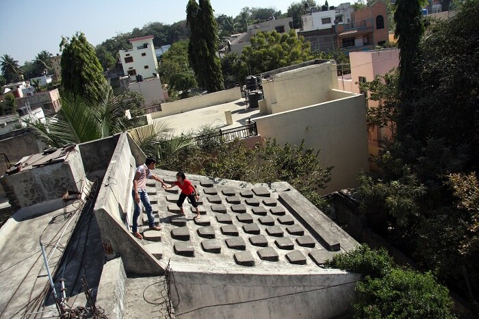 Aurangabad - The Patel grandchildren play at their typewriter roof (Photo - Chirodeep Chaudhuri)