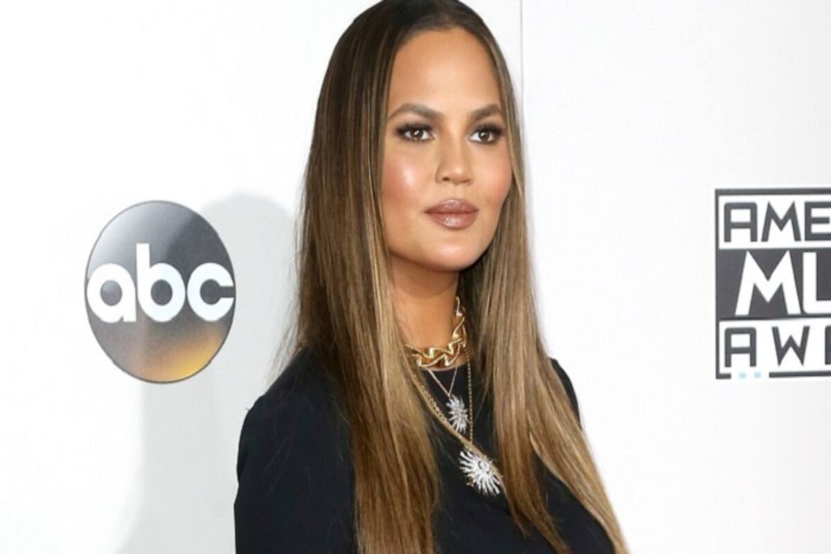 Chrissy Teigen flashes everything as she goes without underwear at