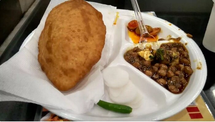 Chhole Bhaturey cooked in deshi ghee at Standard Burfee. Credits: Zomato
