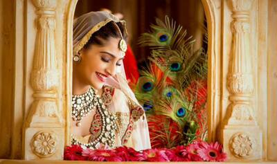 sachin and babi light blue dress Sonam Kapoor dazzles in a flowy satin dress
