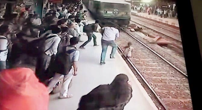   (She then runs towards the platform, with commuters ready to pull her to safety)