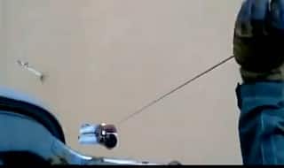 Gujarat: IAF Helicopter Winches Man Clinging Onto Electric Pole Amidst Gushing Flood Waters (Watch Video)