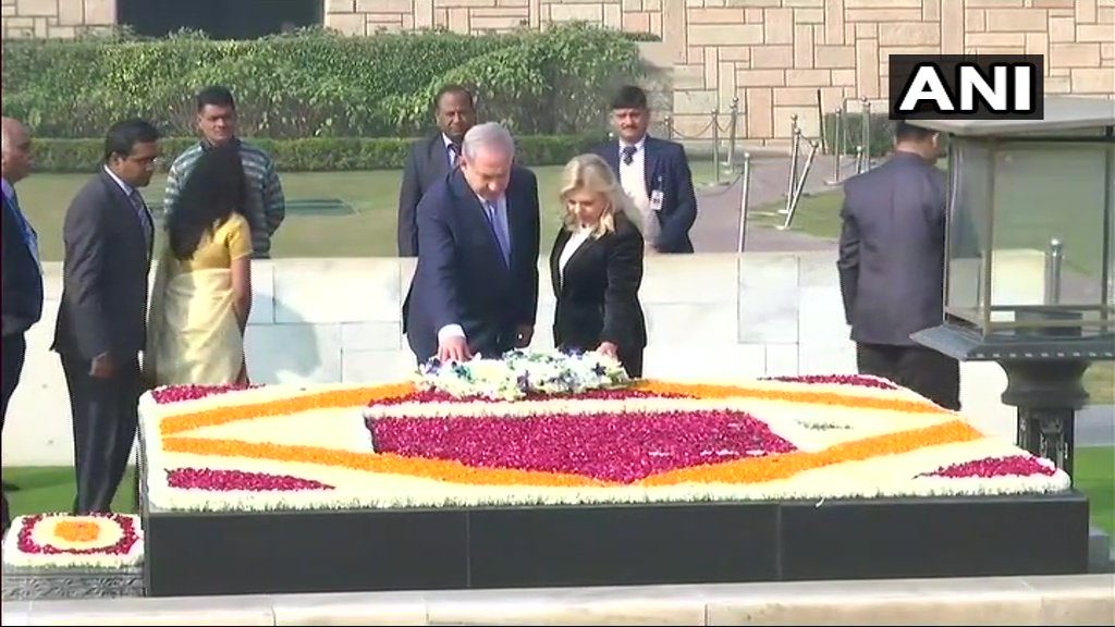 Israel PM Benjamin Netanyahu, wife Sara at Raj Ghat. (Photo/ANI)