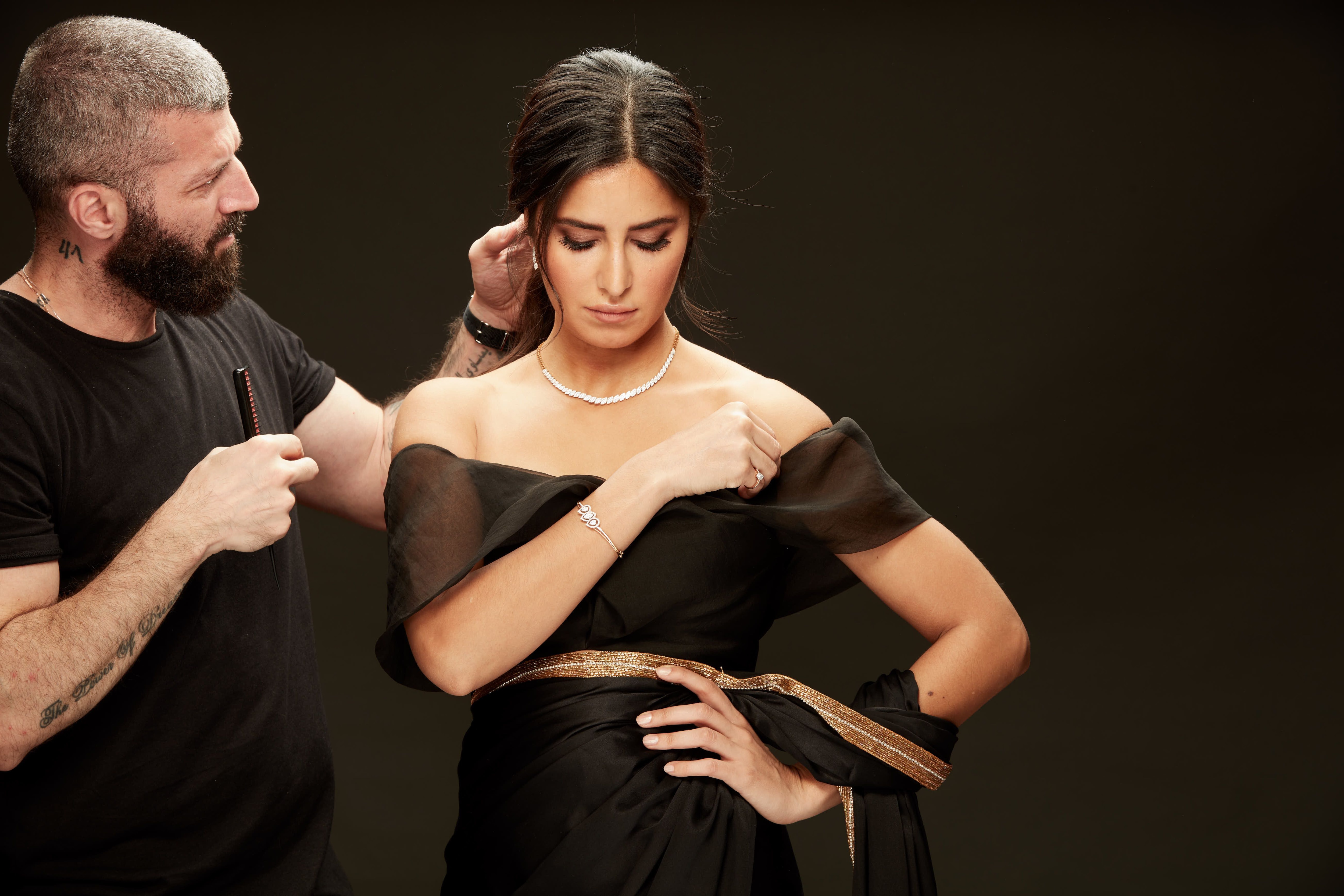 Katrina Kaif posing in an all black outfit at Kalyan Jewellers photoshoot.