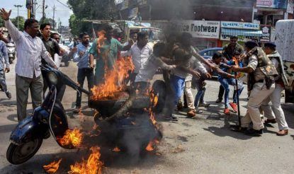 Congress party workers set a scooter on fire during Bharat Bandh in Jabalpur