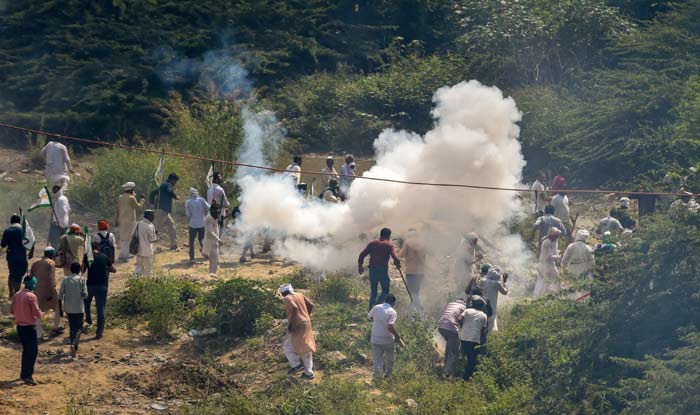 Police use tear gas to disperse farmers protesting at Delhi-UP border during Kisan Kranti Padyatra in New Delhi
