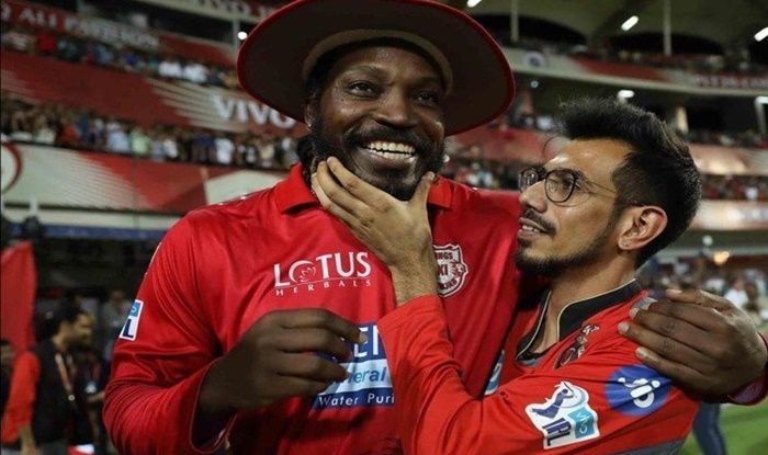 Chris Gayle and Yuzvendra Chahal pose after an IPL match%C2%A9BCCI