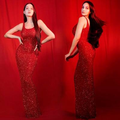 nora fatehi red dress photo Nora Fatehi (@norafatehi) adorns // red embroidered blouse paired with draped ruffle saree Shop the look Online at RidhiMehra.com At our DLF Emporio store: Call/WhatsApp: +91 9818370088