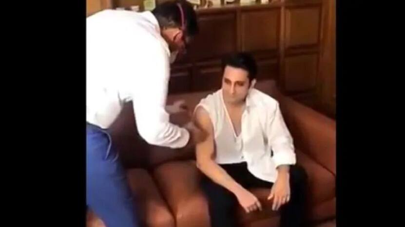 Adar Poonawala taking a shot of Covishield. (Photo: Screengrab from video)