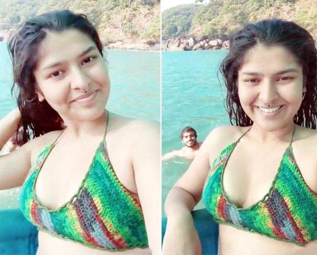 Nidhi bhanushali enjoying herself in the sea in a multicolor bikini
