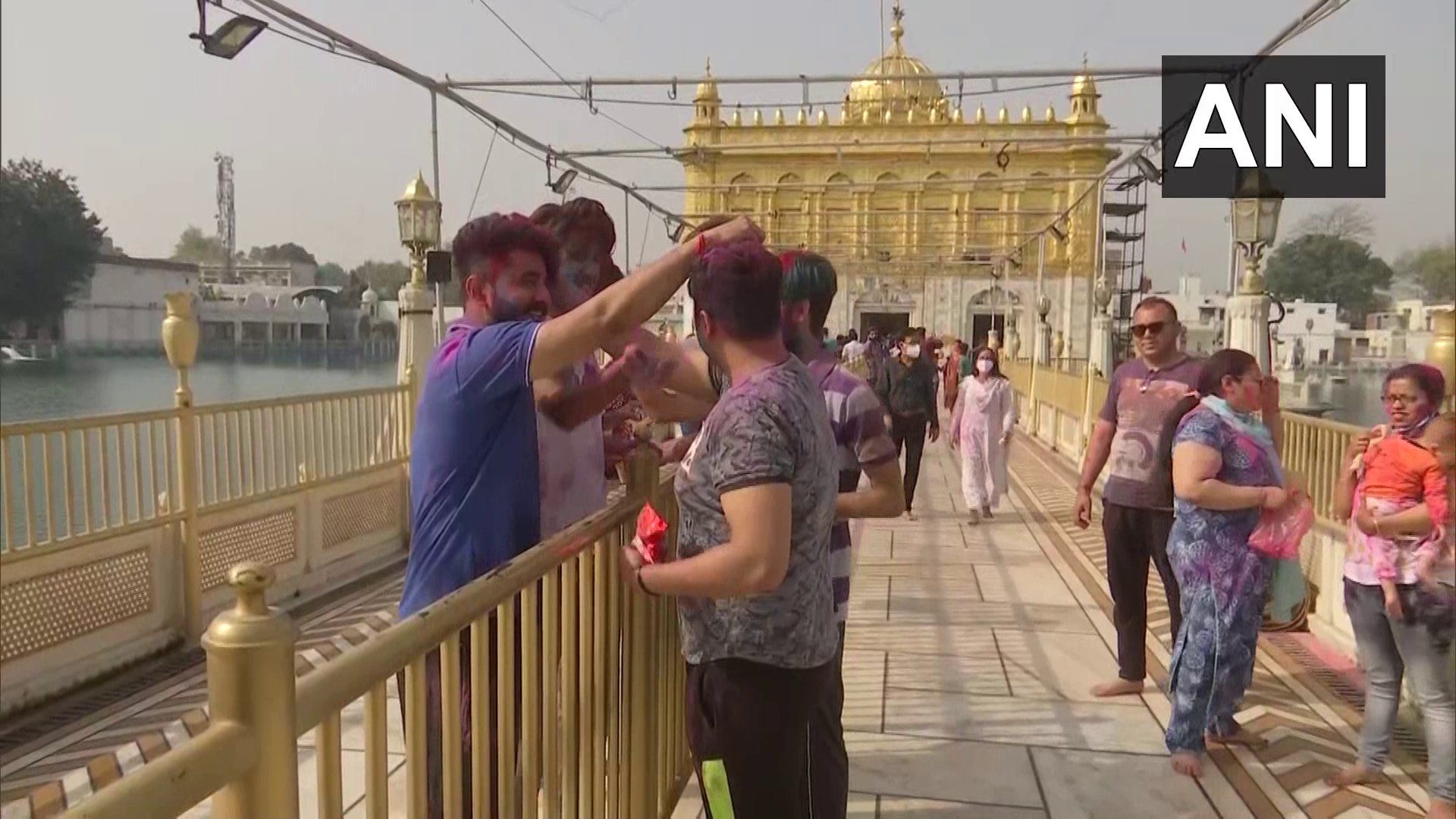 Holi 2021: People immerse in Holi celebration in Amritsar's Golden Temple.