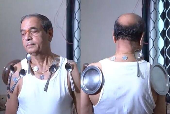 As Arvind turns around, the metal objects don't seem to fall off of his body. (Photo: Screengrabs from YouTube video)