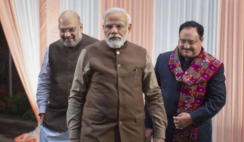 PM Modi, Home Minister Amit Shah (L), BJP Chief JP Nadda (R)