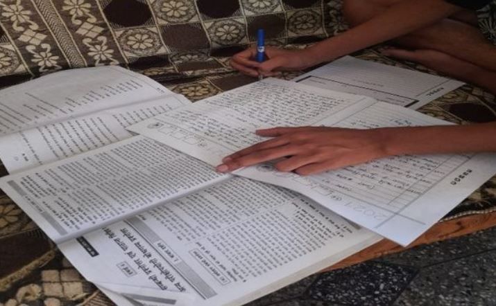 Photos of Students Writing Exam with Guide Books Goes Viral, Answers Posted on YouTube Channels