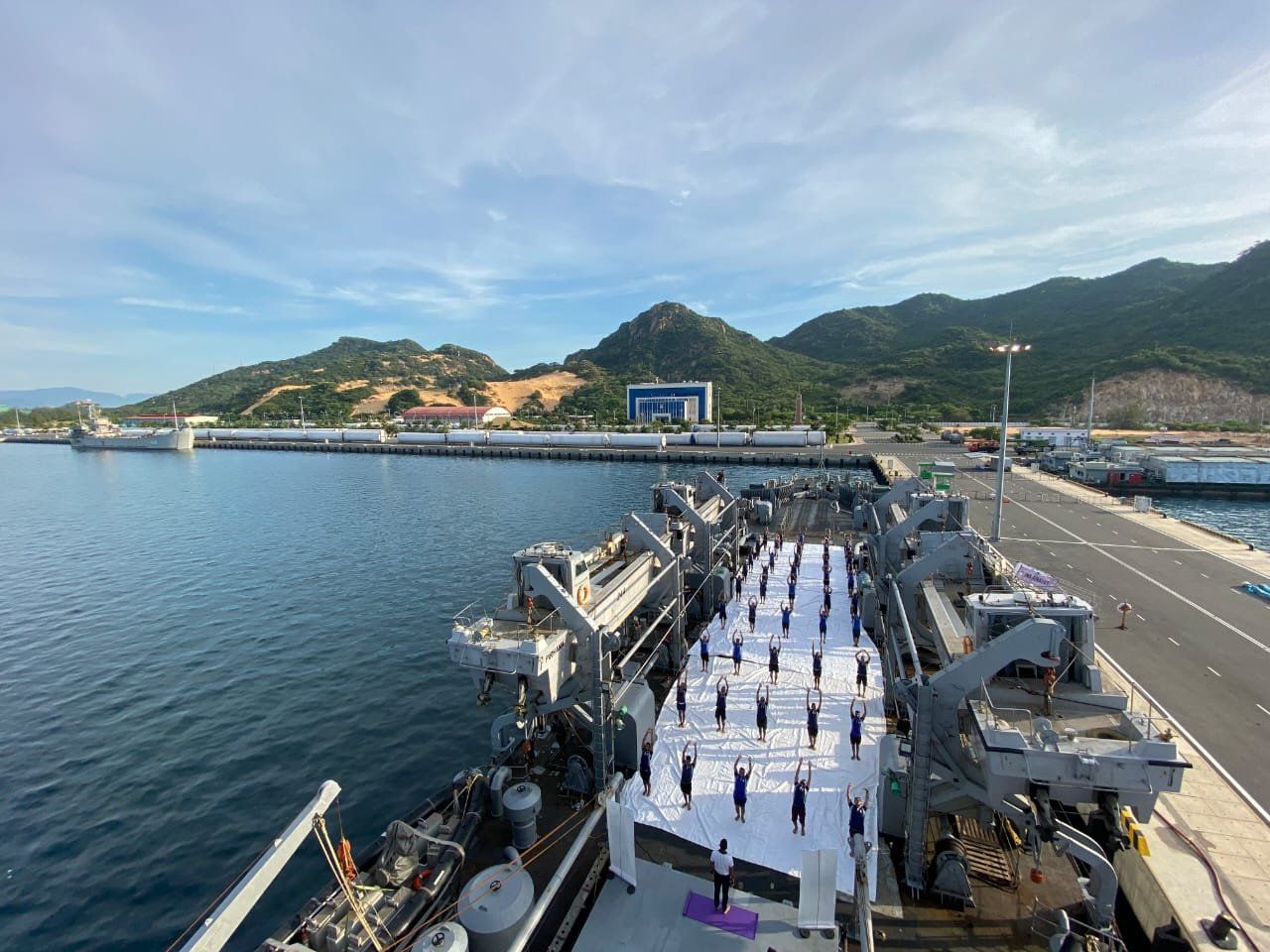 Indian Navy personnel, onboard INS Airavat and deployed at Cam Ranh Bay in Vietnam, perform Yoga