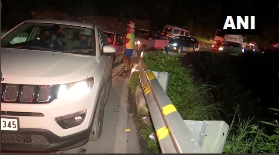 People continue to wait in their vehicles as traffic jam takes time to clear.