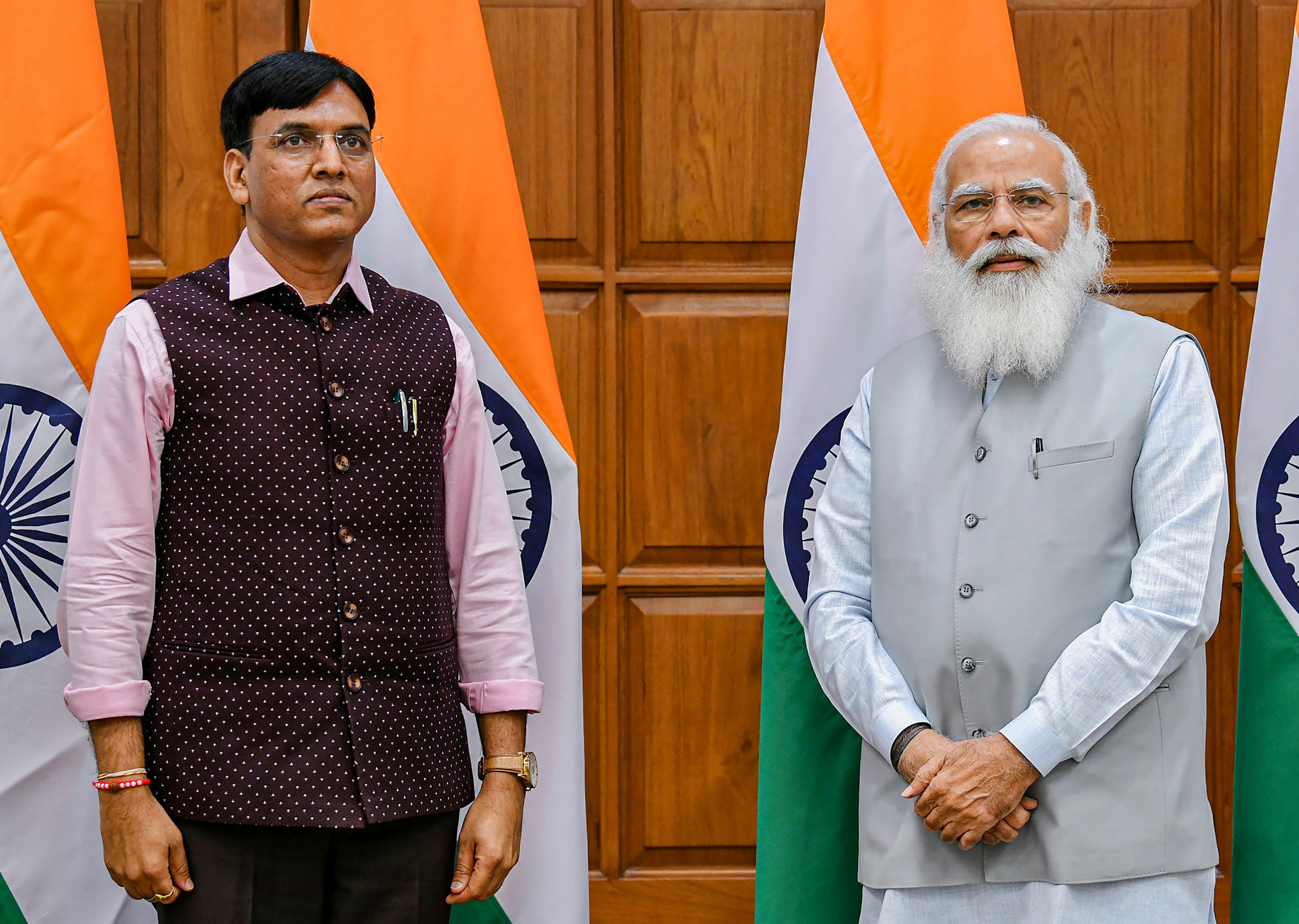 Newly-appointed Health Minister Mansukh Mandaviya with Prime Minister Narendra Modi before taking oath. (PTI Photo)