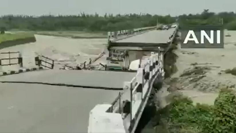 A video showed a few vehicles under the broken part of the bridge and a man walking out of the rubble.