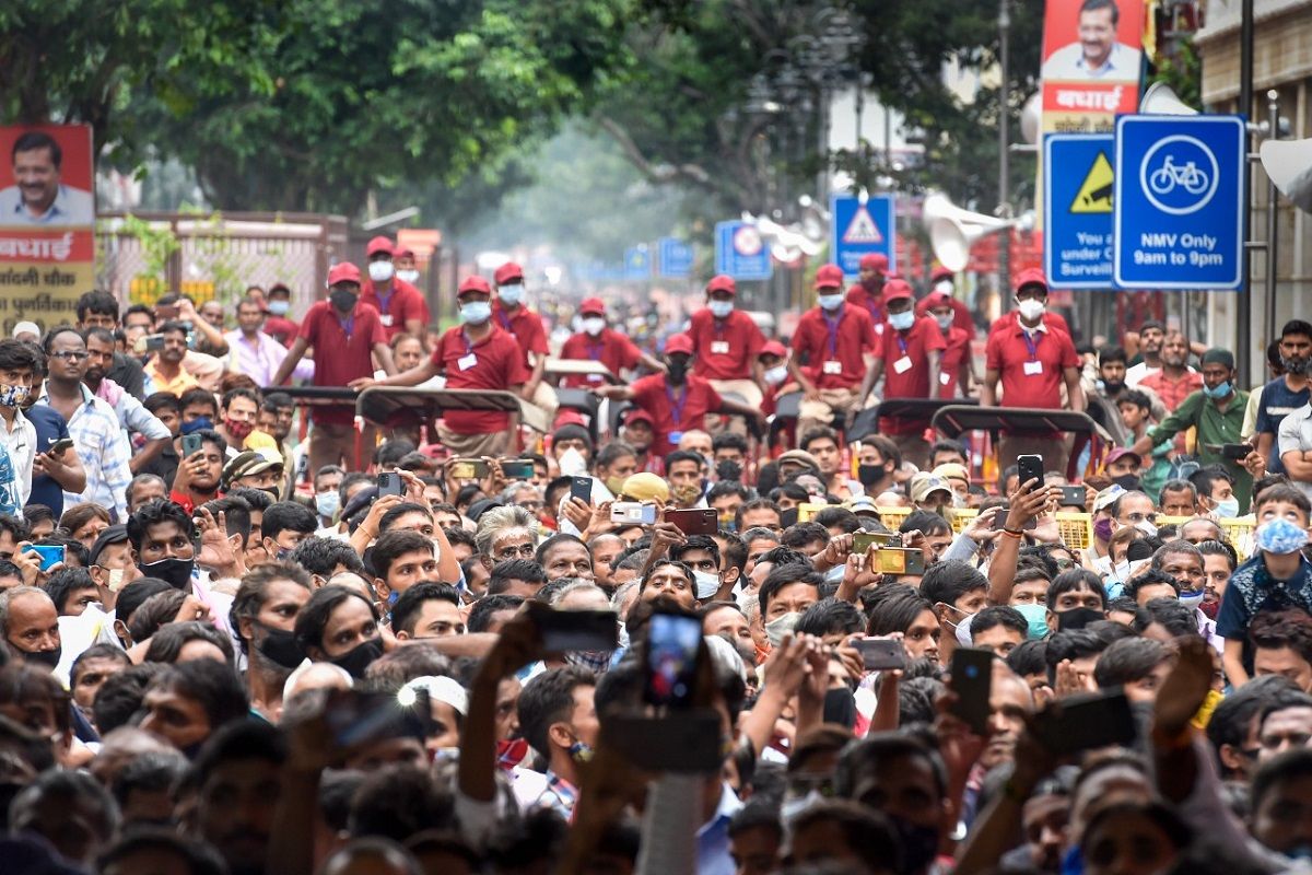 People gather during the inauguration of redeveloped Chandni Chowk market in New Delhi, Sunday, Sept. 12, 2021.