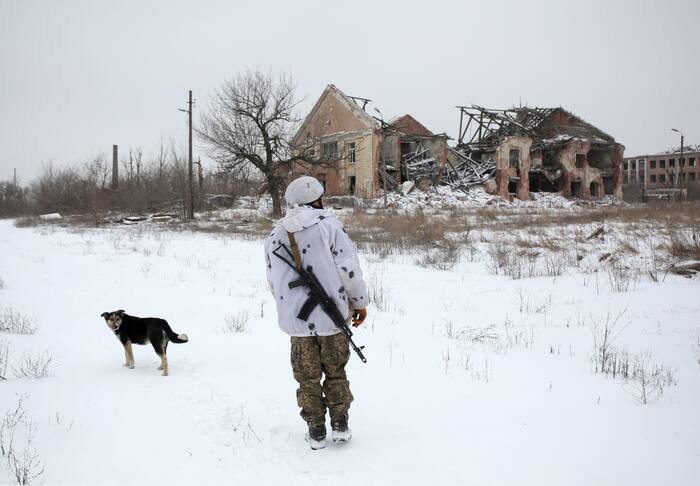A Ukrainian Military Forces serviceman walks in the Donetsk region village of Peski, close to the front-line with Russia-backed separatists on January 25,2022. (AFP Photo)