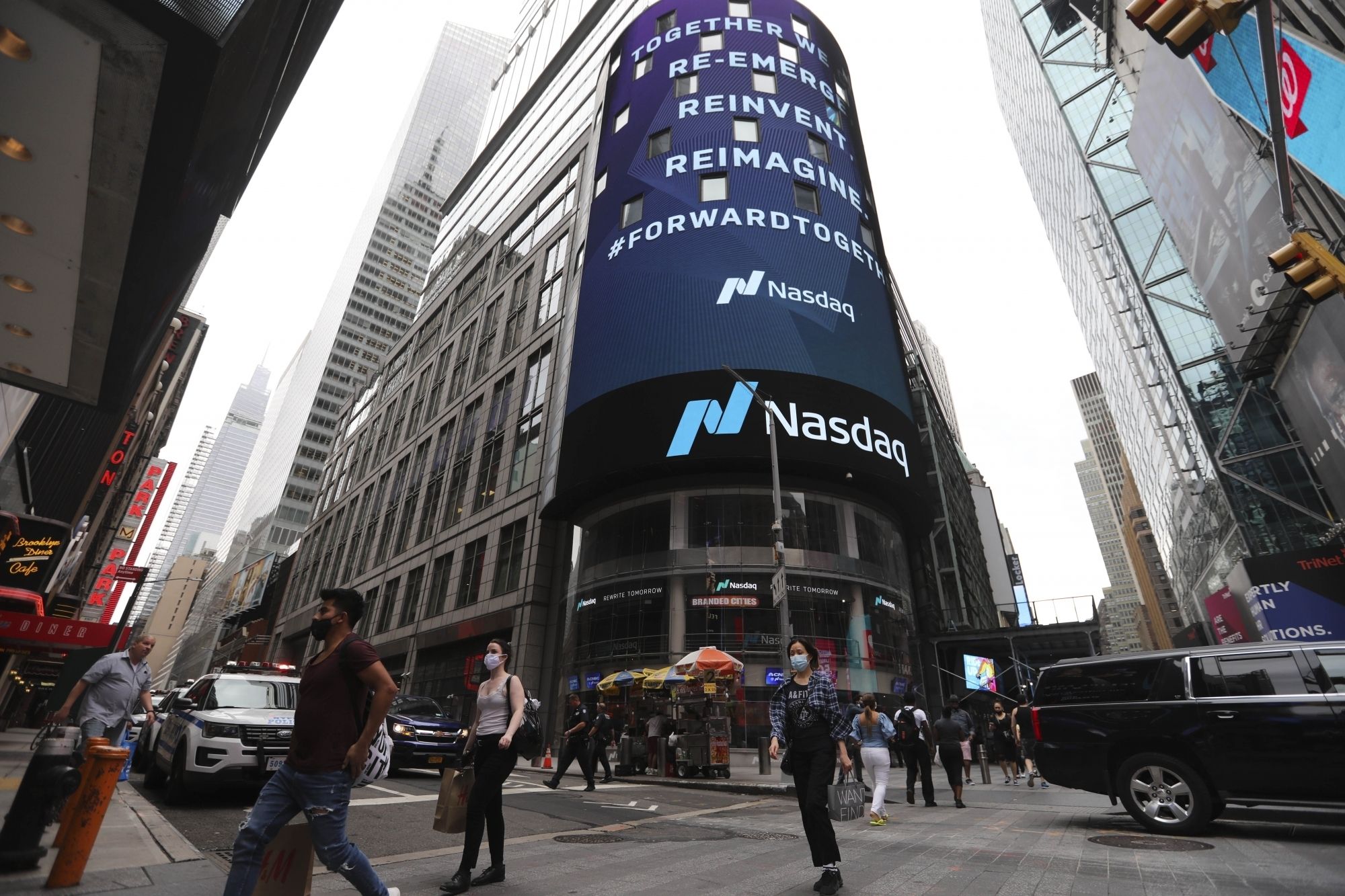 Pedestrians walk past the New York Stock Exchange (NYSE) in New York, the United States.