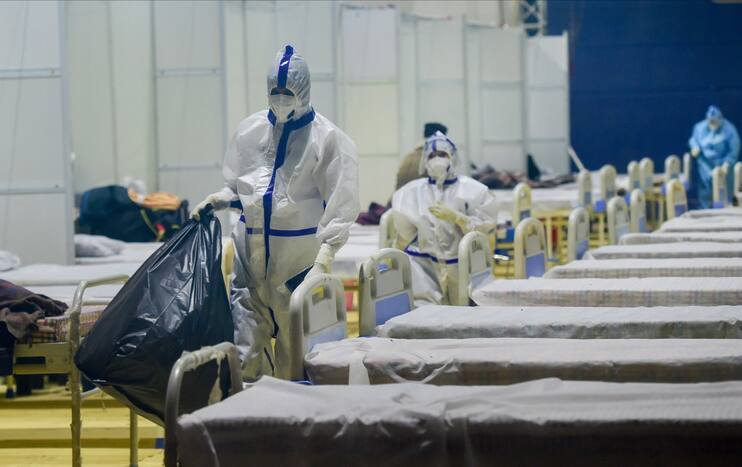 Health workers during a cleaning drive inside a Covid Care Centre.