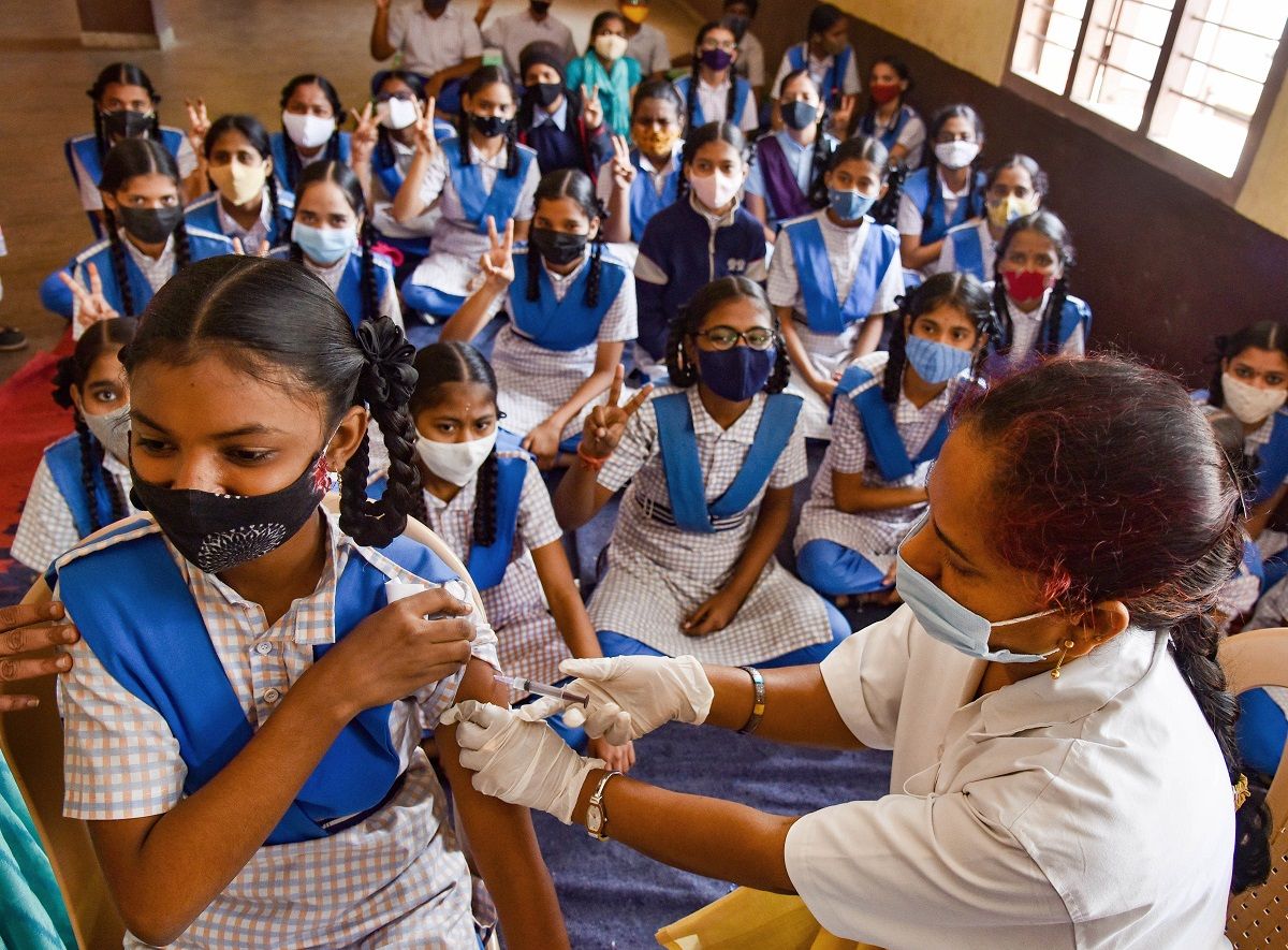 School children receive COVID-19 vaccine dose, at a government school, in Hyderabad, Thursday, Jan. 6, 2022. (PTI Photo)