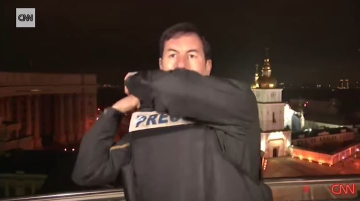 Video: CNN Reporter in Ukraine Capital Pauses Live Broadcast to Put on Protective Gear After Hearing Blasts | WATCH