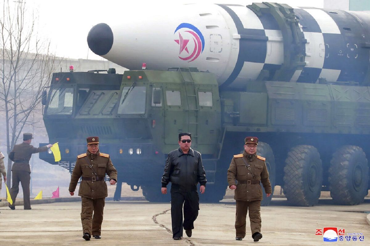 In this photo distributed by the North Korean government, North Korean leader Kim Jong Un, center, walks around what it says a Hwasong-17 ICBM on the launcher, at an undisclosed location in North Korea on March 24, 2022. (Photo: Korean Central News Agency/Korea News Service via AP)