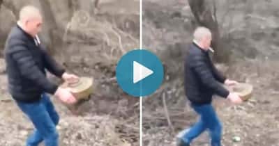 Ukrainian Man Moves Land Mine With His Bare Hands While Smoking A Cigarette,  Internet Calls Him Badass
