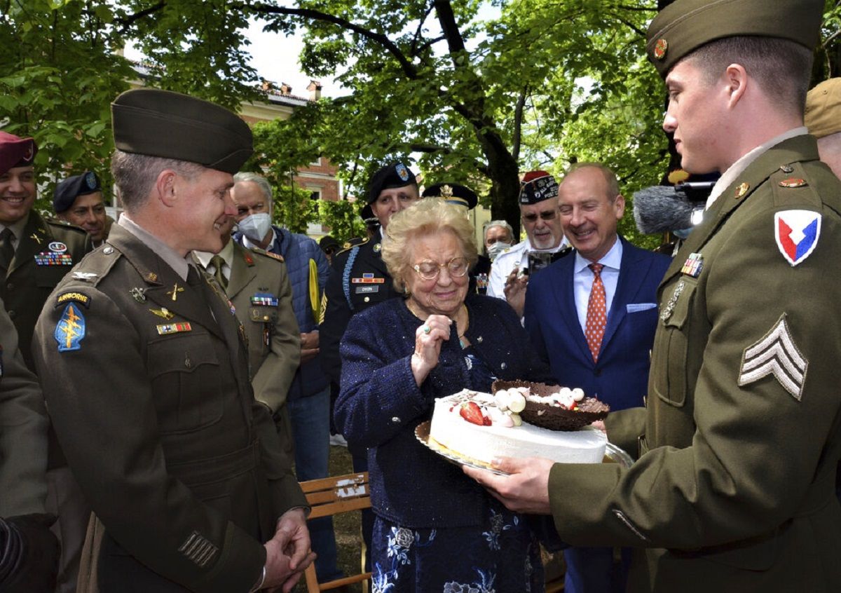 Soldiers from U.S. Army Garrison Italy return a birthday cake to Meri Mion, center, in Vicenza, northern Italy, Thursday, April 28, 2022. (Photo: Laura Krieder, U.S. Army via AP)