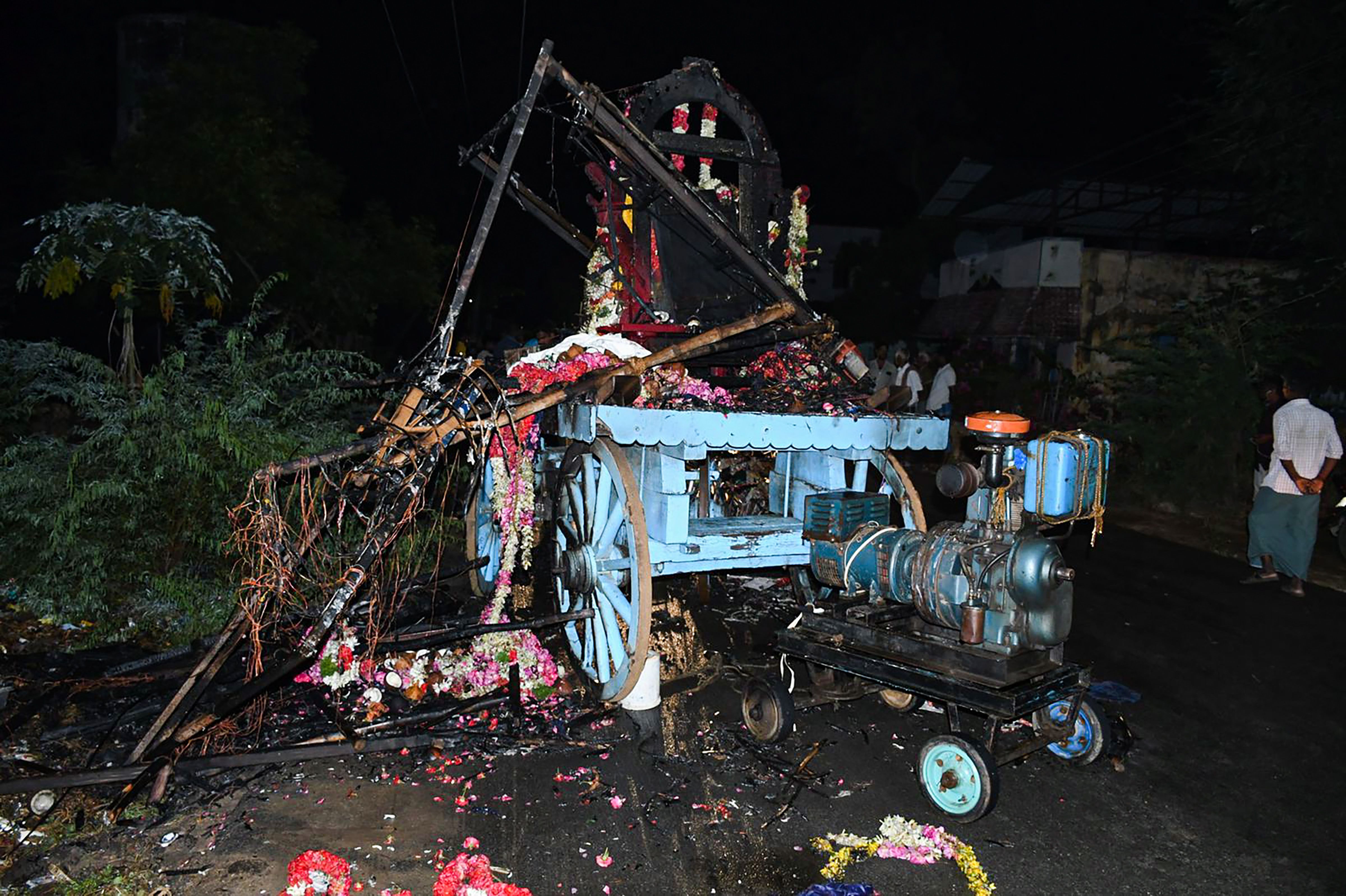 Mangled remains of the chariot after several people were electrocuted during a chariot procession, in Kalimedu area of Thanjavur district, Wednesday, April 27, 2022. (PTI photo)