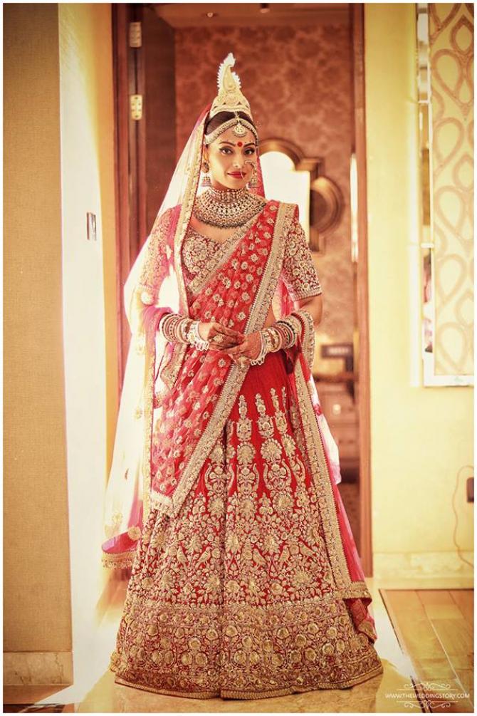 Bipasha Basu looked ravishing in red and golden colour saree designed by Sabyasachi