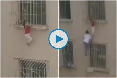 Watch: Man climbs out of window to rescue toddler hanging from 8th floor in  Kazakhstan