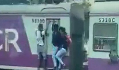 Spine-Chilling Video: Teenager Falls Off Local Train, Escapes Death by Inches | WATCH
