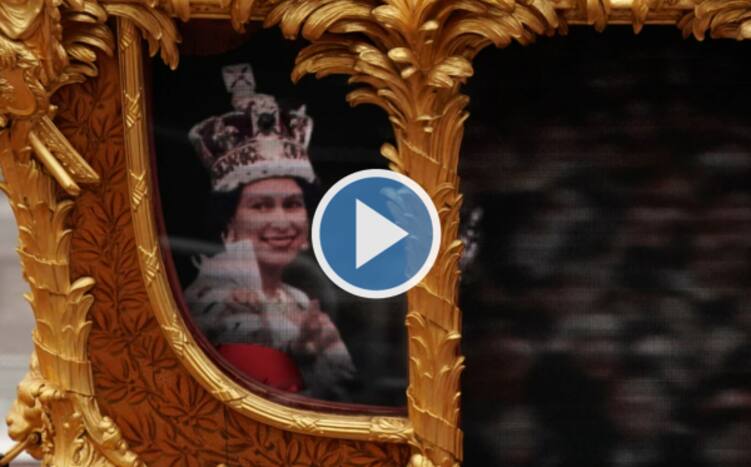 Queen Elizabeths Hologram Waves to Crowds In Golden Carriage At