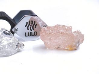 [This photo supplied by Lucapa Diamond Company on Wednesday, July 27, 2022, shows the 170 carat pink diamond, right, recovered from Lulo, Angola. (Photo: Lucapa Diamond Company via AP)]