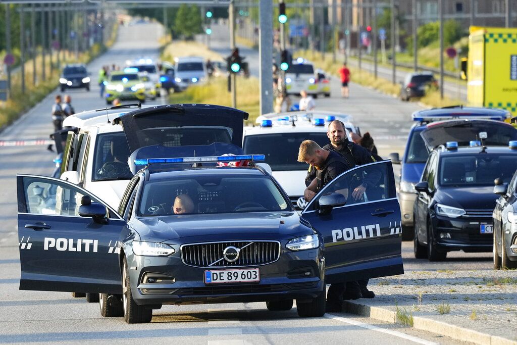 Police and emergency services at the Field's shopping center after a shooting, in Copenhagen, Denmark, Sunday, July 3, 2022. Danish police said Sunday that several people were shot at a Copenhagen shopping mall, one of the largest in Scandinavia. Copenhagen police said that one person has been arrested in connection with the shooting at the Field’s shopping mall, which is close to the city's airport. Police tweeted that several people have been hit, but gave no other details. (Claus Bech/Ritzau Scanpix via AP)