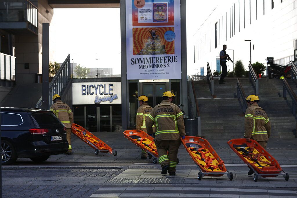 Emergency services at the Field's shopping center after a shooting, in Copenhagen, Denmark, Sunday July 3, 2022. Danish police say several people have been shot at a Copenhagen shopping mall. Copenhagen police said that one person has been arrested in connection with the shooting at the Field’s shopping mall on Sunday. Police tweeted that several people have been hit but gave no other details. (Olafur Steinar Gestsson/Ritzau Scanpix via AP)