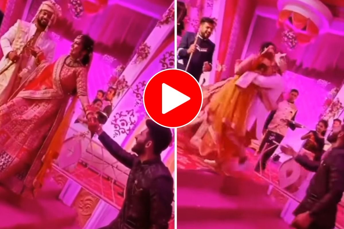 Viral Video Man Tries To Take Away Bride From Stage, Then Groom Does