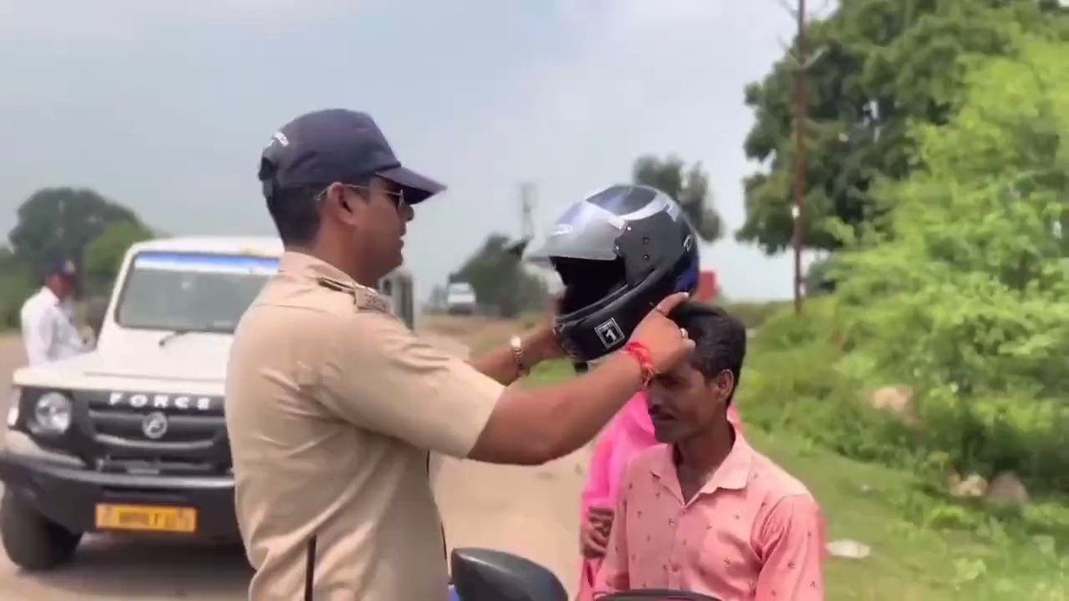 Viral Video Police Officer Responds to Man Riding Bike Without Helmet