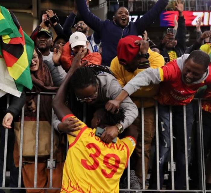 Zimbabwe Player Giving Hug