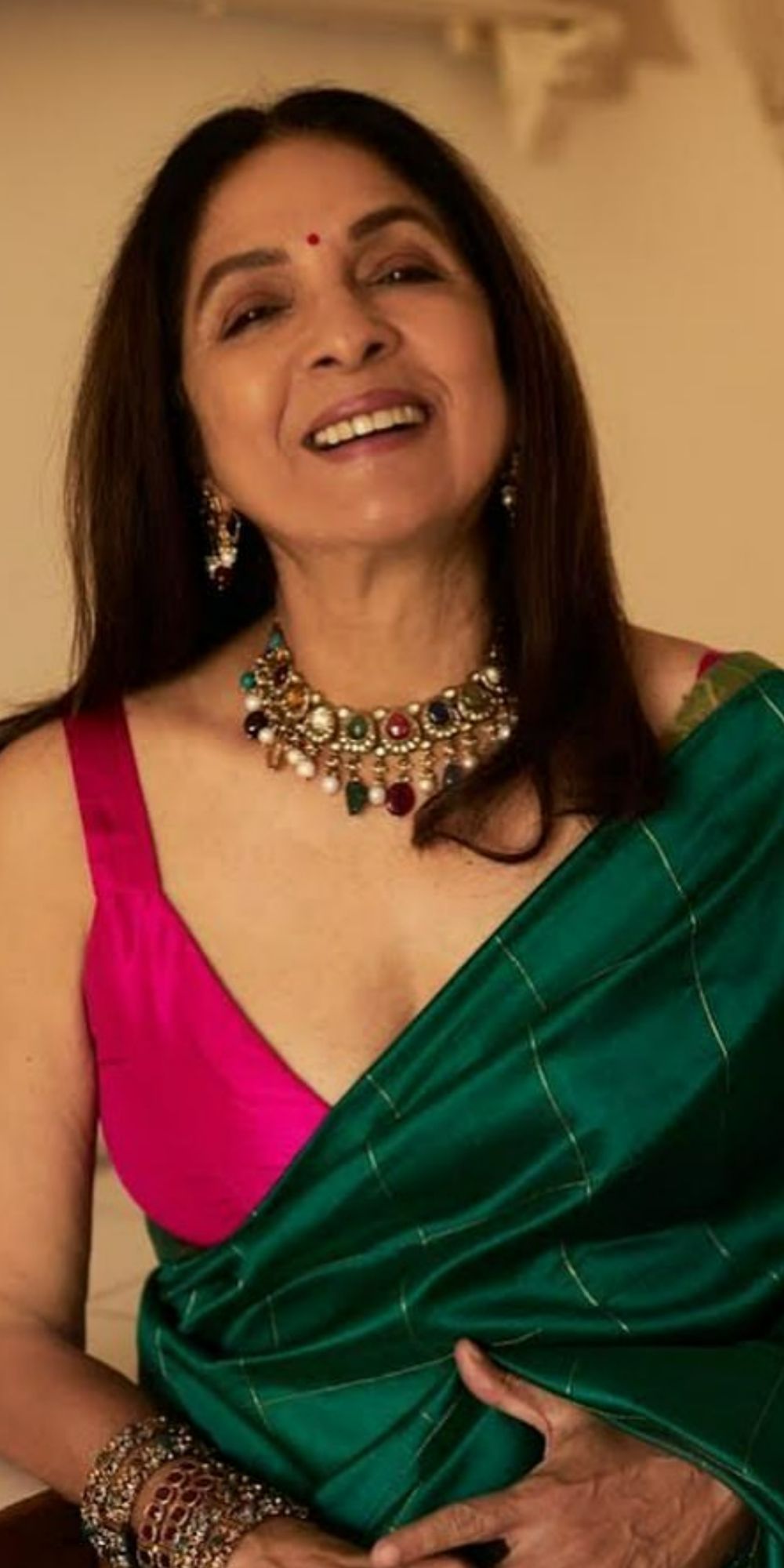 Neena Gupta looked lovely in an orange and pink saree with a sleeveless  blouse for the trailer launch of Goodbye Photo